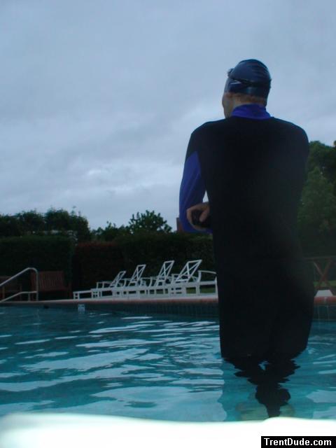 swimmer dude in wetsuit on cloudy day