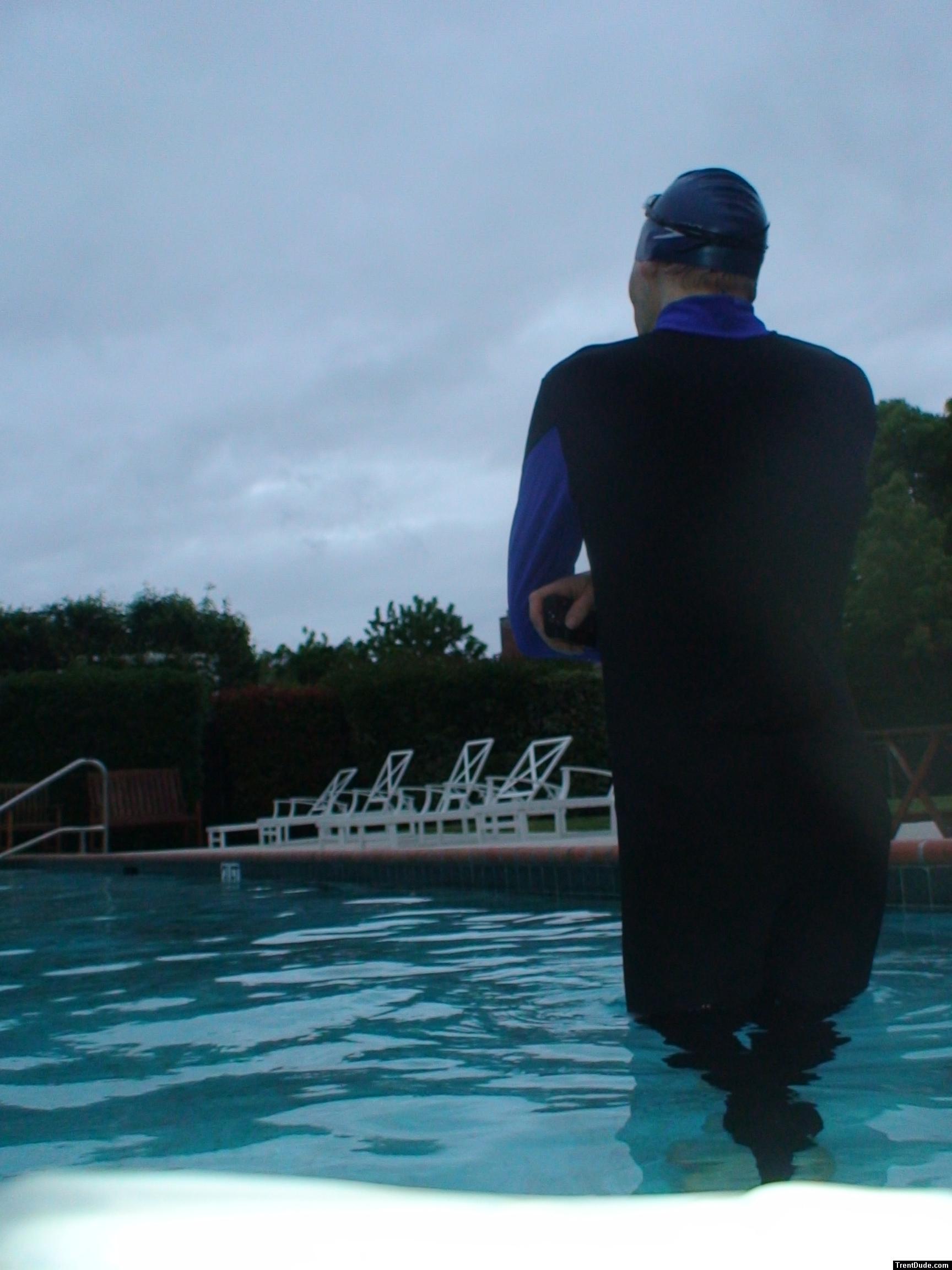 swimmer dude in wetsuit on cloudy day