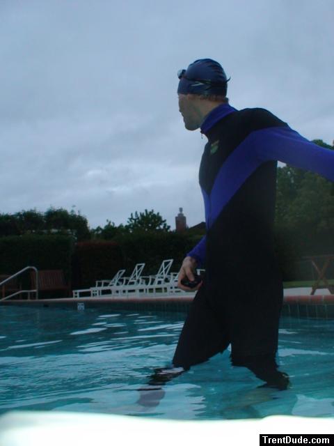 swimmer dude in wetsuit on cold day