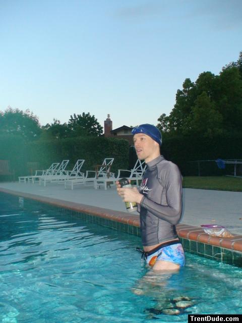 The rashguard is grey when dry, black when wet.