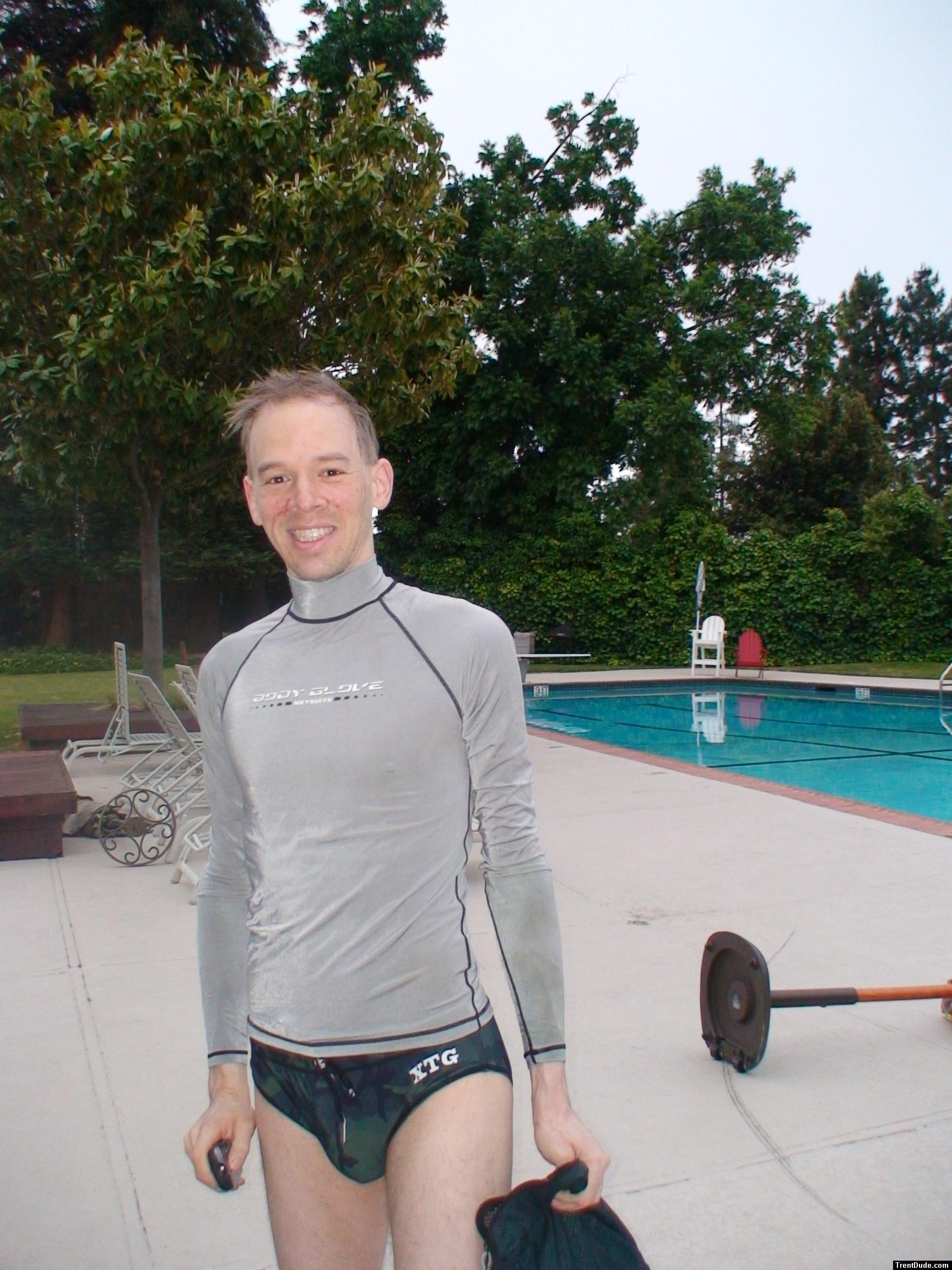 Dude in body glove rash guard, camouflage speedo