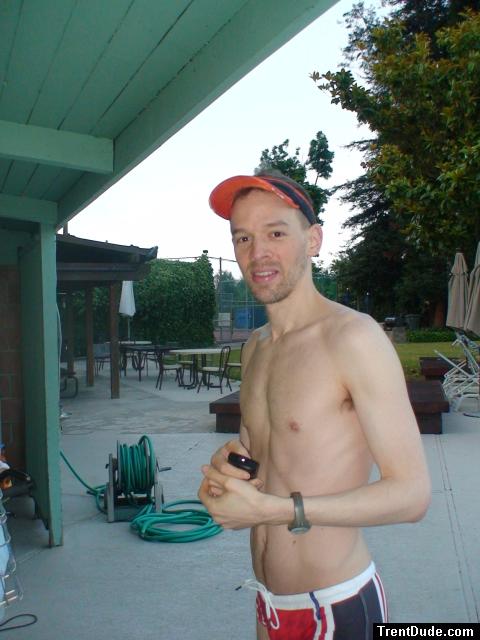 unshaven wearing a lifeguard speedo