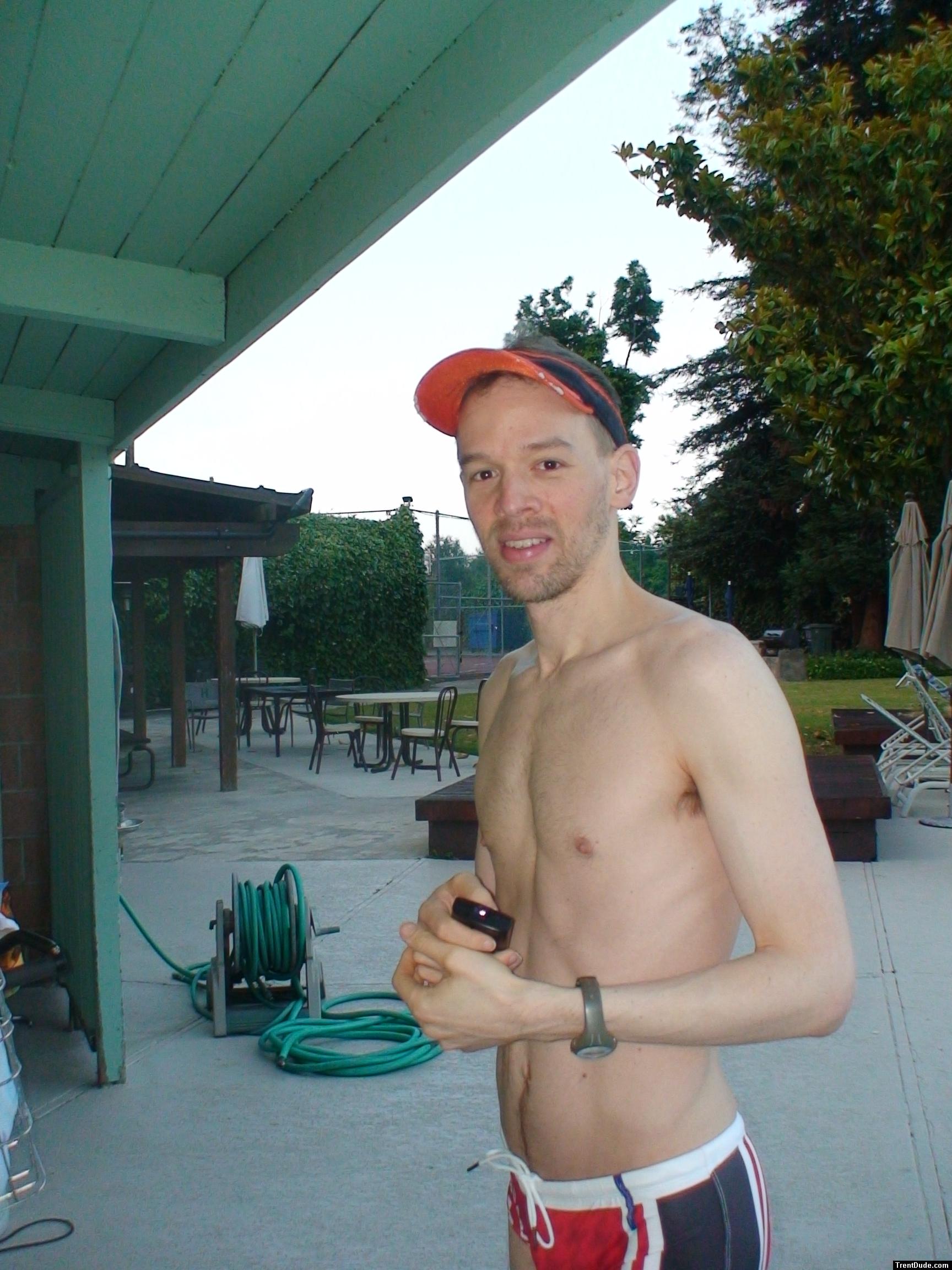 unshaven wearing a lifeguard speedo