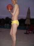 Dude in yellow speedo, with basketball