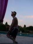 Stretching in a speedo and Addidas shorts