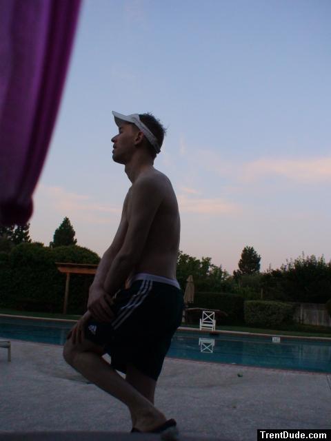 Stretching in a speedo and Addidas shorts