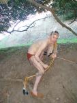 Practicing archery in a loin cloth