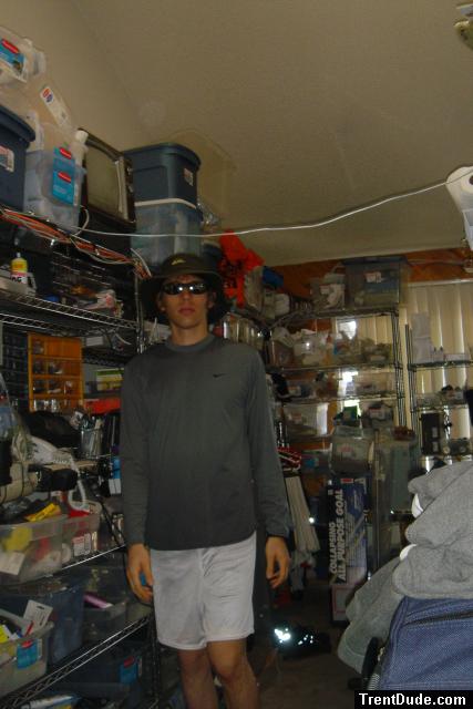 Trent wearing Quiksilver Full safari hat, Ray-ban sun glasses, Nike exercise shirt, Dodger water pants.  This outfit is forsale!