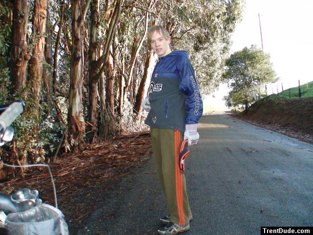 football windbreaker, addidas sweat pants in front of eucalyptus tree