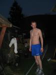Outside in blue shorts and band-aids