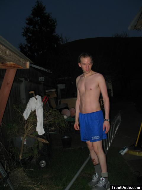 Outside in blue shorts and band-aids