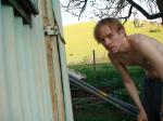 outside by the cows shirtless