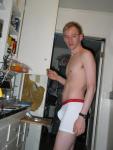 Calvin Klein white boxer briefs pouch in the kitchen (model)