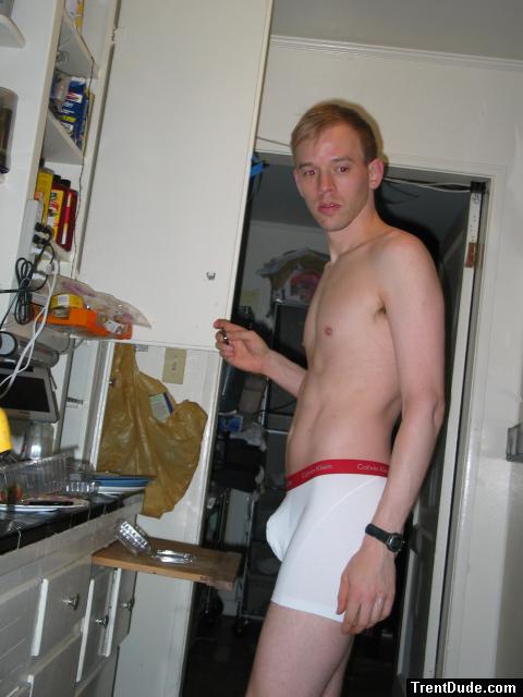 Calvin Klein white boxer briefs pouch in the kitchen (model)