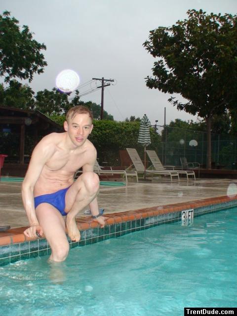 Getting ready to swim in a blue Nike speedo