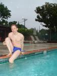 leg streches in Blue Nike speedo at the pool