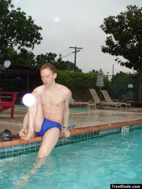 Stretching in a Blue Nike Speedo