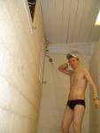 Showering in  blue striped Speedo