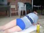 Morning stretches in Blue Nike swim brief (butt)