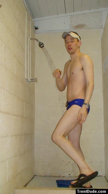 Showering after a swim in blue Nike swim brief (butt)