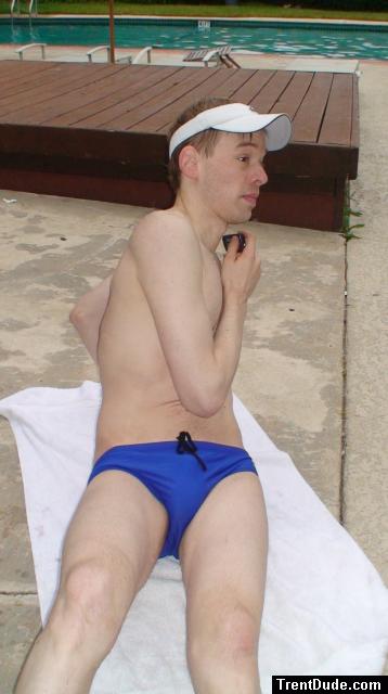 Stretching in blue nike swim briefs