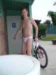 Should he ride the bicycle in a white speedo?