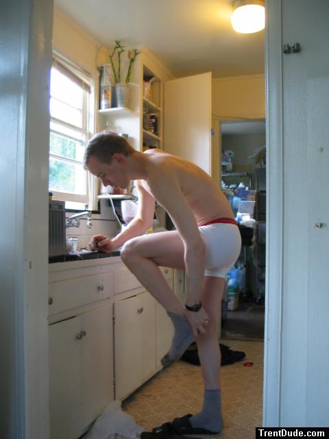 Pulling off his socks