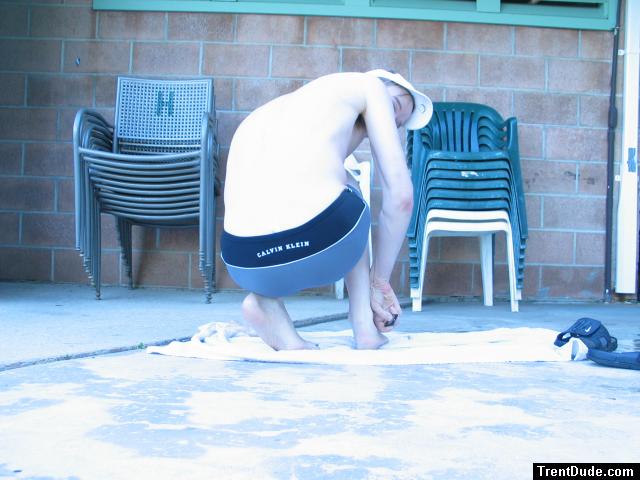 Showing his feet in a Calvin Kelin swim boxer (black/dolphin) from Macys.com