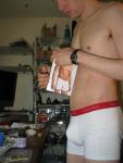 Opening his new pair of boxer briefs