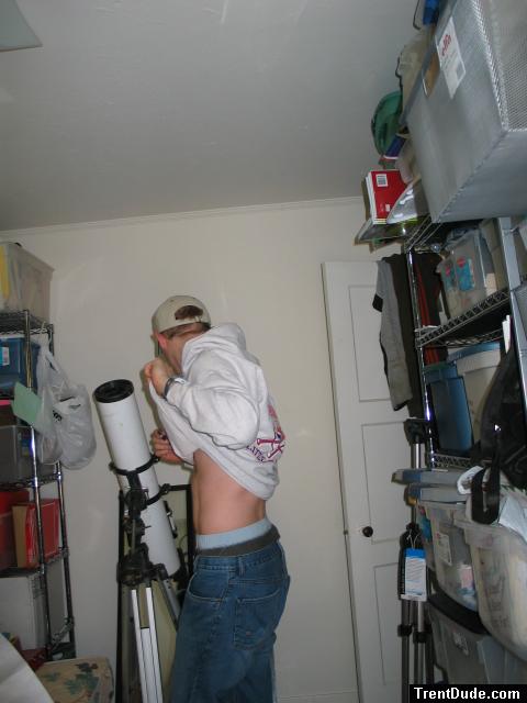 Guy checking out his abs, Quiksilver jeans,wal-mart boxers, sweatshirt