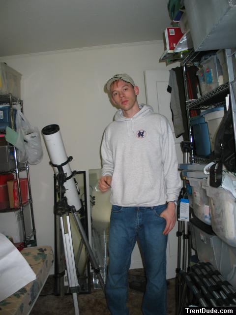 Student dude in Oneil jeans, sweatshirt (next to a telescope)