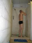 Showering in a Speedo training suit