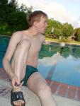 Stretching in a Nike green speedo (bulge)!