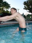 Stretching in Green speedos!