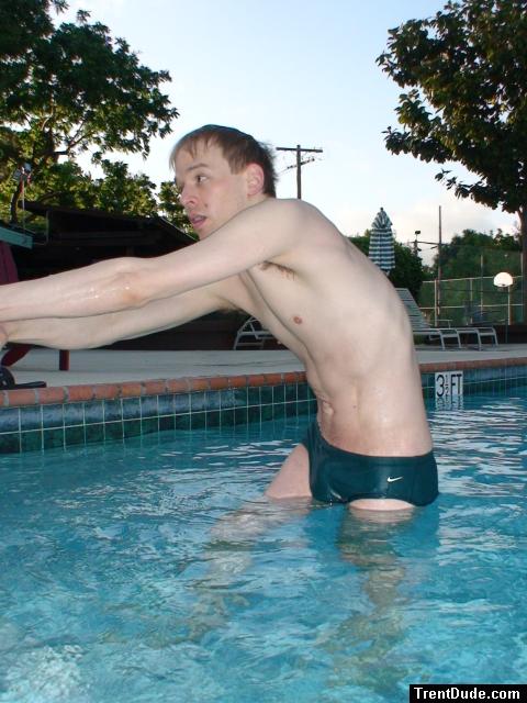 Stretching in Green speedos!