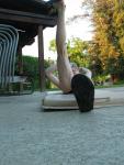 Stretching in a speedo (toned leg)