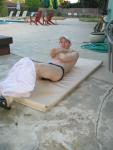 Doing 50 sit-ups in his speedo