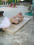 Doing 50 sit-ups in his speedo