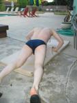 doing a pushup wearing a navy blue Speedo Solar 1" Swim Brief from Macys.com