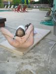In the middle of a sit-up (bald)