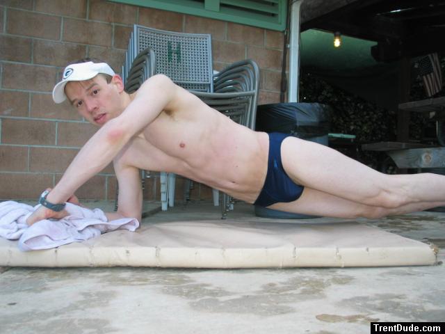 doing a pushup wearing a navy blue Speedo Solar 1" Swim Brief from Macys.com