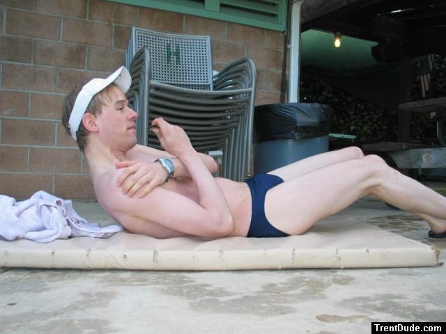 Sit-ups in a blue speedo