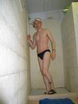 College swimmer athlete in a blue speedo.  Locker room (smile) (best)