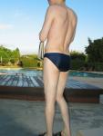 Swimmer showing body in a blue speedo brief