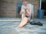 Hugging his leg