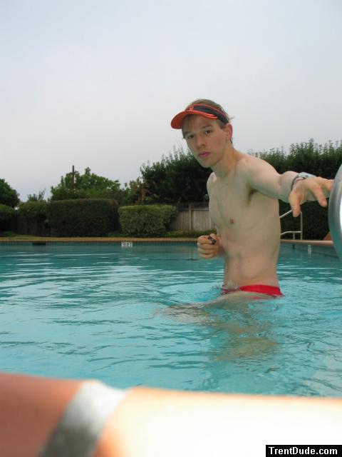 In the water wearing a Red Speedo