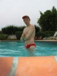 Smiling in his red speedo