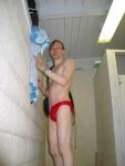 Swimmer washing off his Speedo in the shower