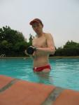 Trying to show his arm muscles in a Red Speedo (strong) (best!)