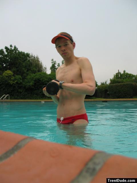 Trying to show his arm muscles in a Red Speedo (strong) (best!)